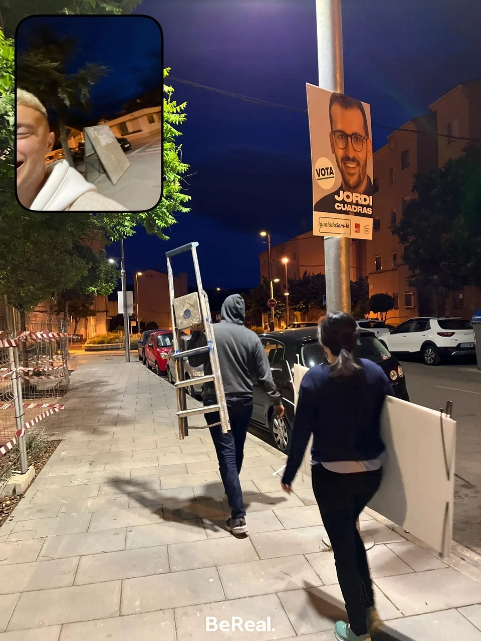 BeReal snapshot of the campaign team putting up Jordi Cuadras posters at night.